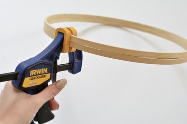 Hand clamp gripping wooden hoops