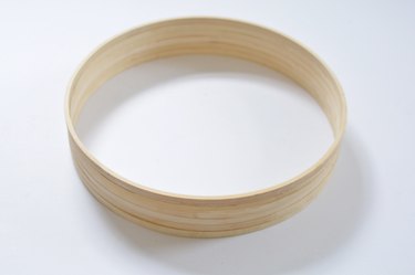 Wooden hoops glued togther to create a circular frame.