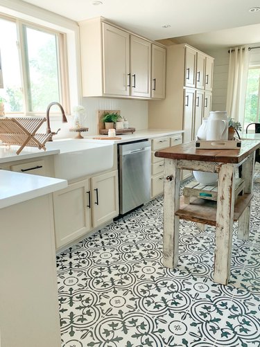 Black and white patterned cement tile farmhouse kitchen floor