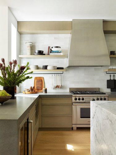 thick concrete countertops in tactile kitchen with marble island