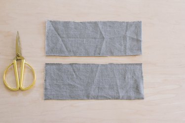 Two rectangles cut out of gray linen fabric