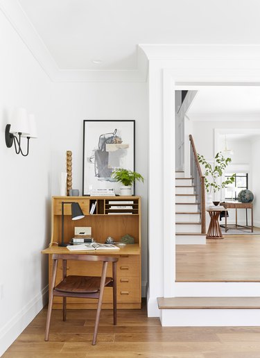 Work space and hardwood floors in traditional living room