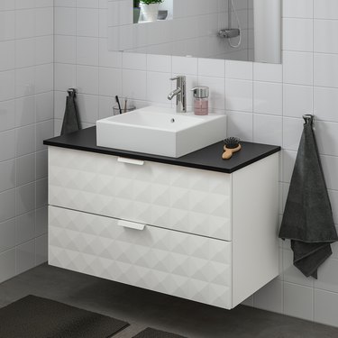 modern bathroom vanity with textured front and double drawers