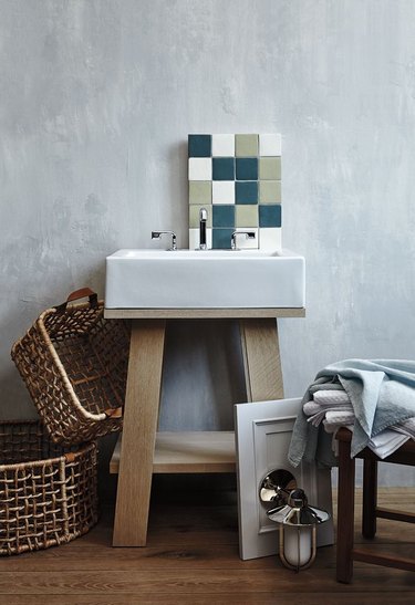 Scandinavian open bathroom vanity with wood base and chrome faucet