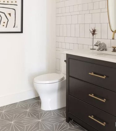 Gray starburst pattern cement tiles in bathroom