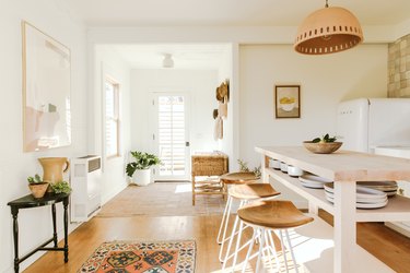 light wood kitchen island ideas for small kitchens with white walls and boho accents