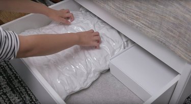 person scratching nails on ikea product