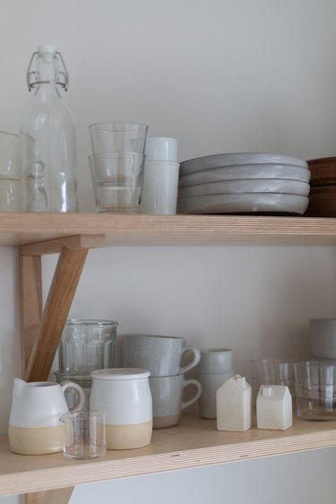 Overhead cabinets were replaced with plywood shelving.