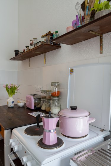 Pops of pink and a converted desk in the kitchen.