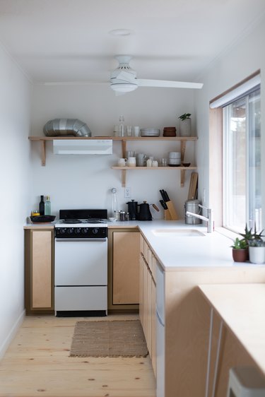 The original kitchen was split in half to create space for a bathroom.