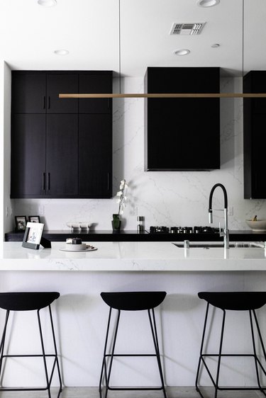 Black and white kitchen with bar/pendant light