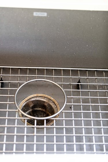 close up of kitchen sink with drainage mesh