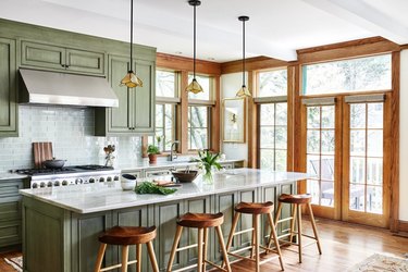 craftsman kitchen cabinets in green with subway tile backsplash