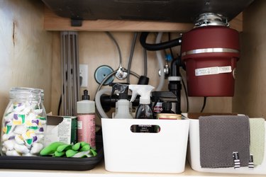 view below kitchen sink with garbage disposal