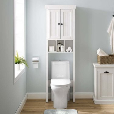 over-the-toilet white bathroom cabinet with open storage