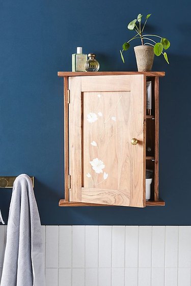wall mounted bathroom cabinet with floral motif
