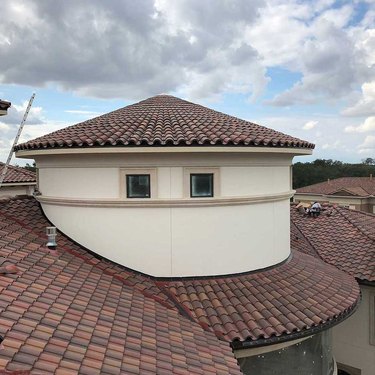 Conical clay tile roof.