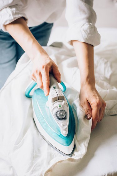 Ironing white bedsheets