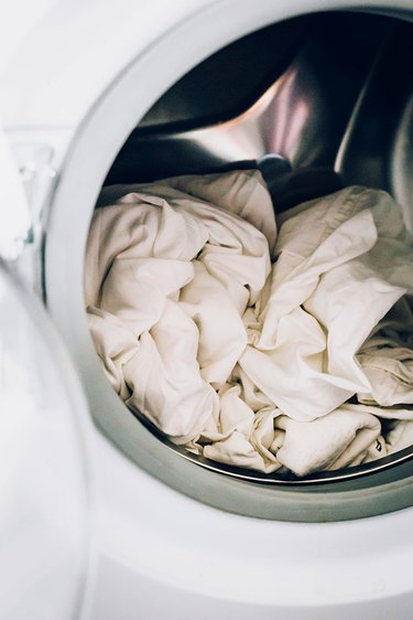Bedsheets loaded in washing machine
