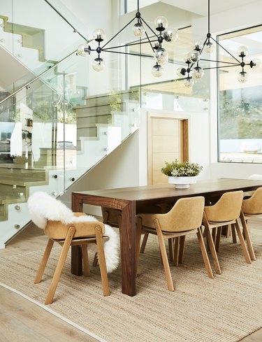bright dining room with light leather chairs