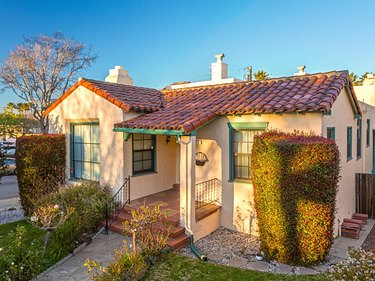 Small house with clay tile roof.