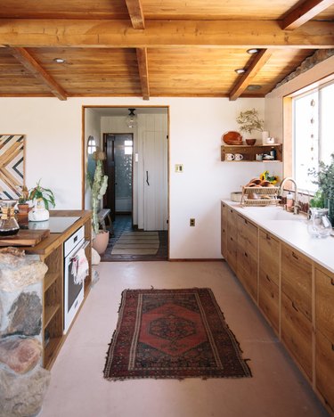 spanish style one wall kitchen with island and wood cabinets