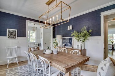 navy coastal dining room with white bentwood chairs and wood dining table