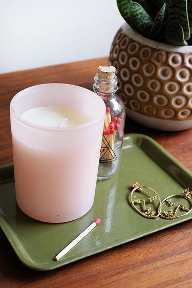 Pink Jar Candle on nightstand