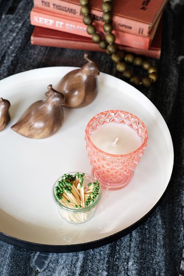 Pink Candle on coffee table.