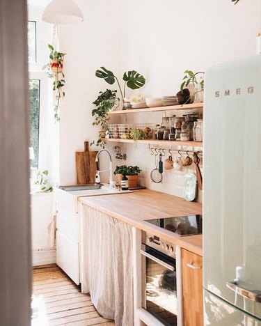 bohemian kitchen with open shelving and wood countertop