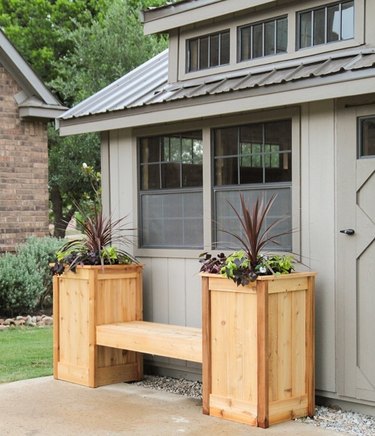 Modern shed in neutral colors with modern wood planters