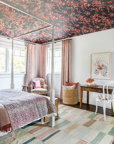 teen bedroom idea for girls with wallpapered ceiling and rosy drapery