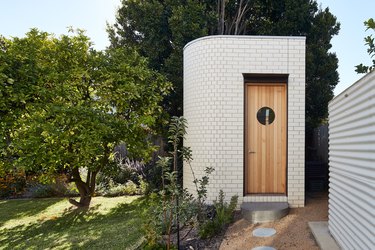 Modern shed with brick exterior and art deco details