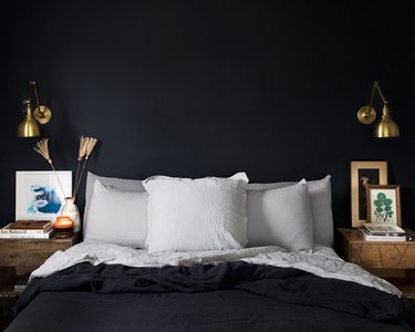 dark guest bedroom idea with plush linens