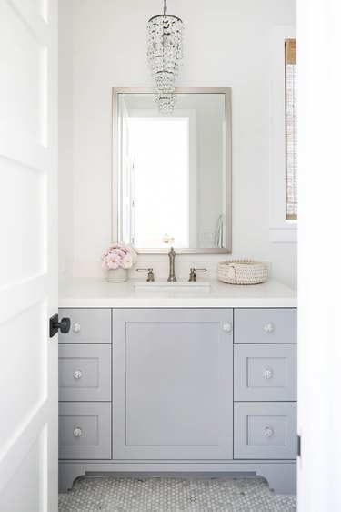 bathroom chandelier lighting idea with crystal fixture over vanity