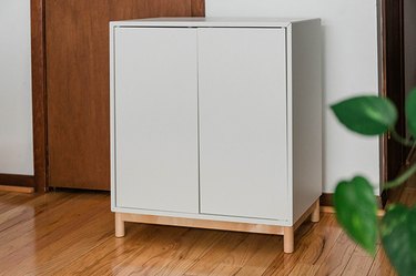 Assemble with you IKEA Eket cabinet using the included instructions.