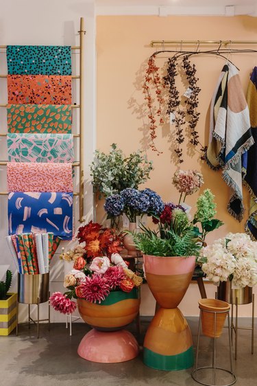 flower arrangement in large colorful pots