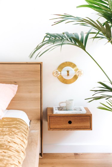 bedside plant in minimalist bedroom