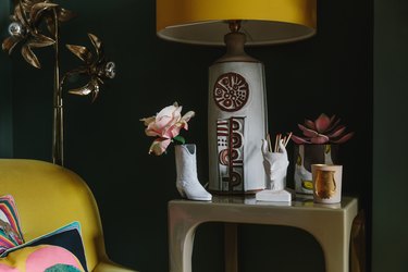 cowboy boot vase and ceramic lamp with yellow shade