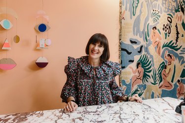 Zoe Anderson behind cash desk of Shoreditch-based homeware store