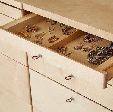 closet drawer filled with organized jewelry