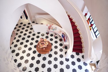 overhead view of black and white floor and large staircase