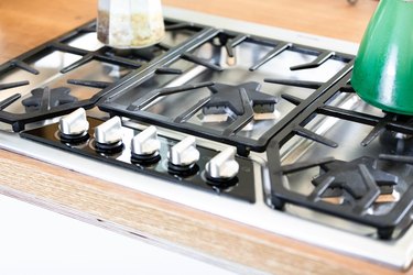 gas cooktop with pot on top