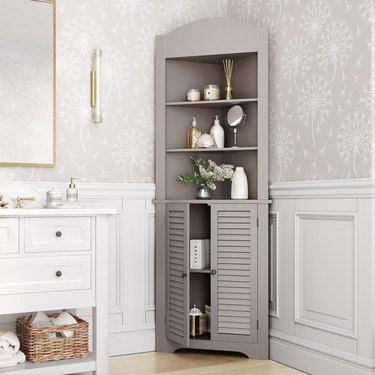 Taupe Corner Bathroom Cabinet in traditional bathroom with chic finishes