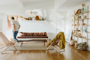 Living room with leather couch and jute rug