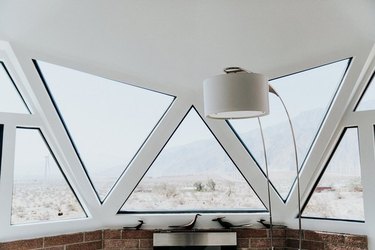 midcentury house overlooking coachella valley with puzzle of triangular and trapezoid-shaped windows