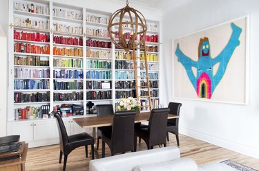 Dining room with bookshelf and art