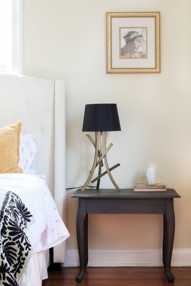 Chalk painted end table styled in bedroom