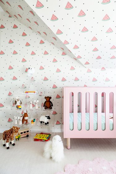 minimalist nursery decor with watermelon wallpaper and pink crib