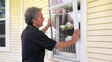 Installing storm windows.